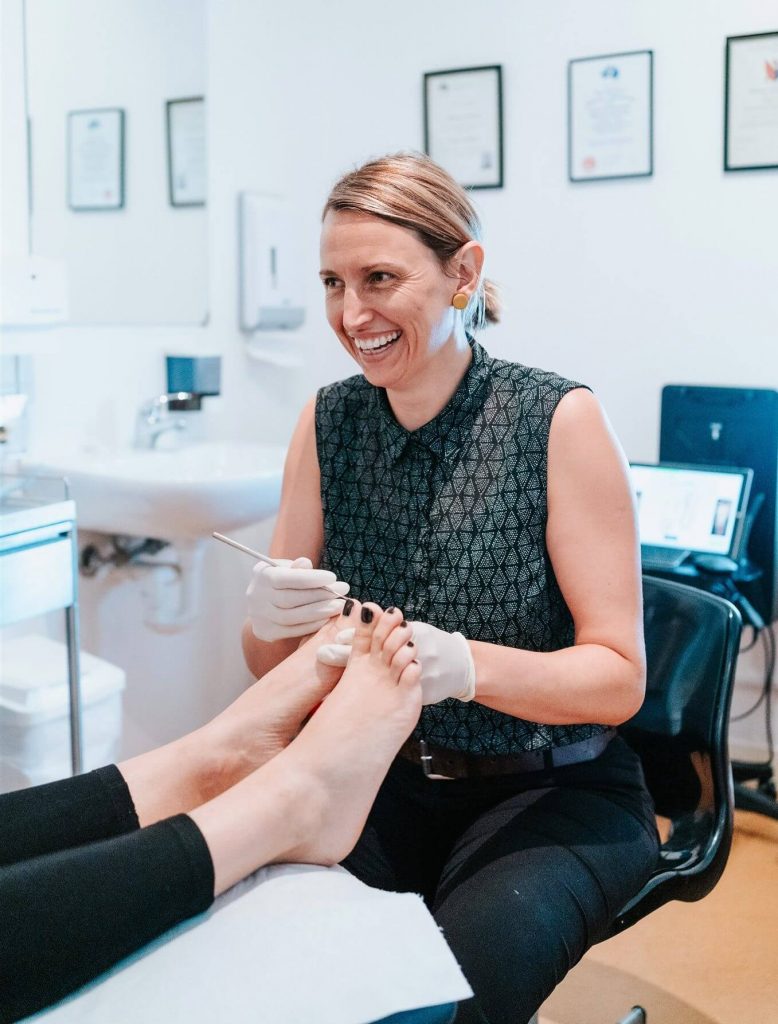 Podiatry Illawarra anna smiling with scalpel and nails
